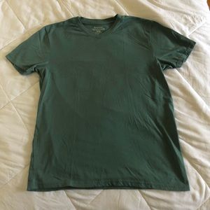 A boxy t-shirt with a lined neck line. Never worn but with no tags.